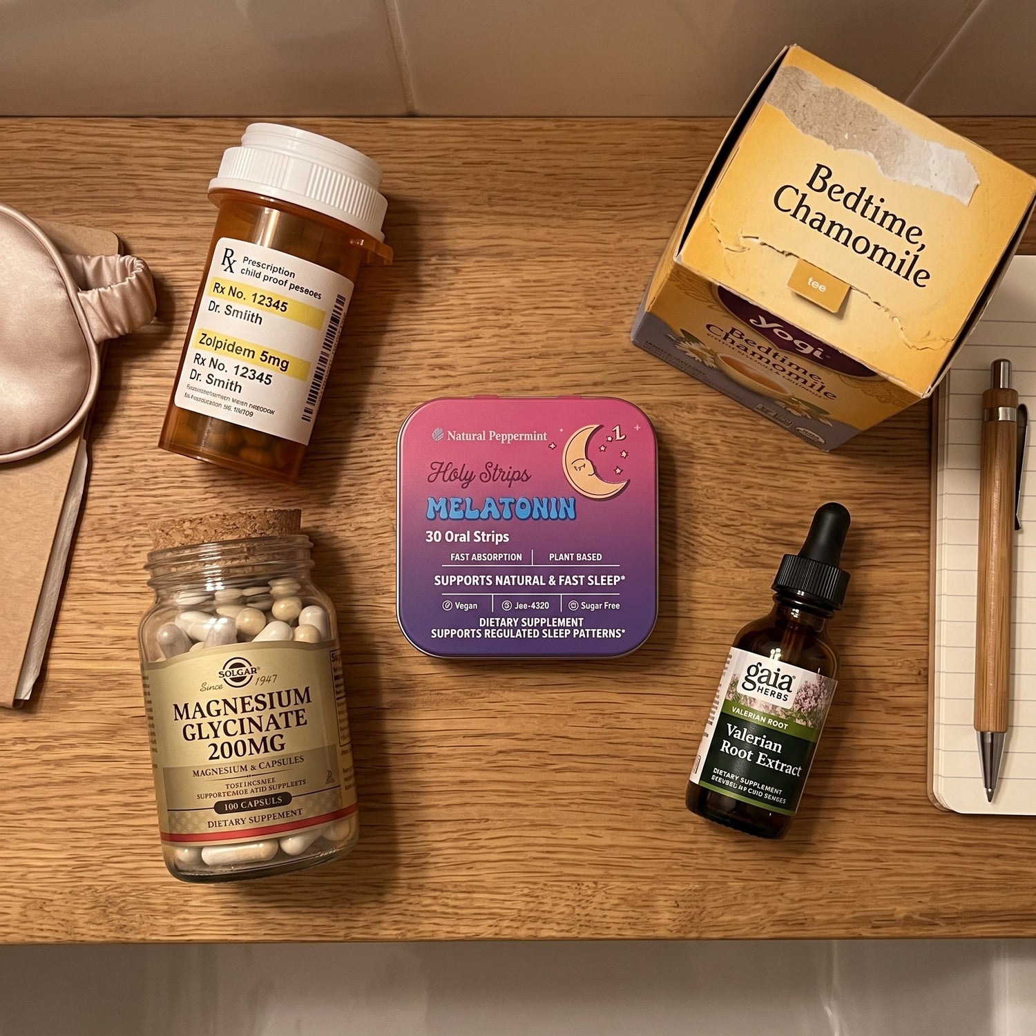 Overhead flat-lay comparing sleep products, including a prescription Zolpidem bottle, chamomile tea, a Holy Strips Melatonin tin, magnesium glycinate, valerian root extract, and a sleep mask.