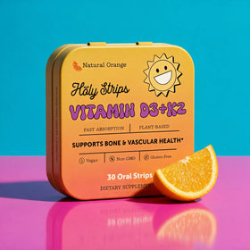 A yellow box of HolyStrips® D3 + k2 by Holy Strips sits on a pink and blue surface, showcasing its immune support benefits and natural ingredients.